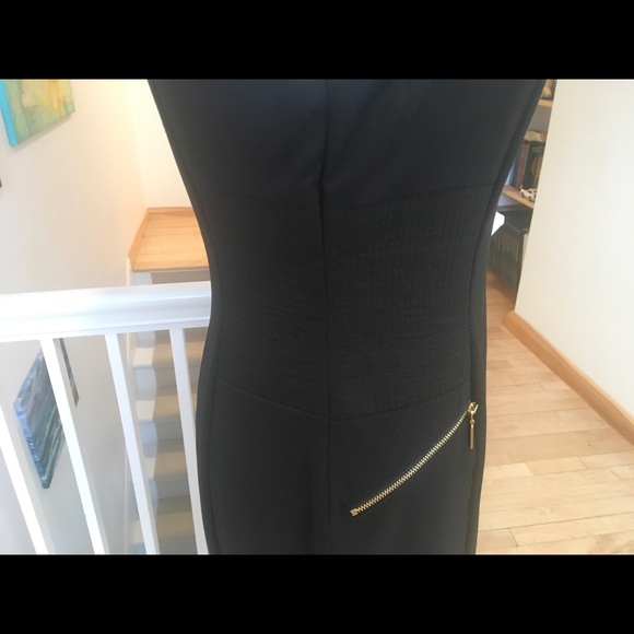 Lovely Calvin Klein black fitted dress, with gold accent pockets. - Picture 8 of 16